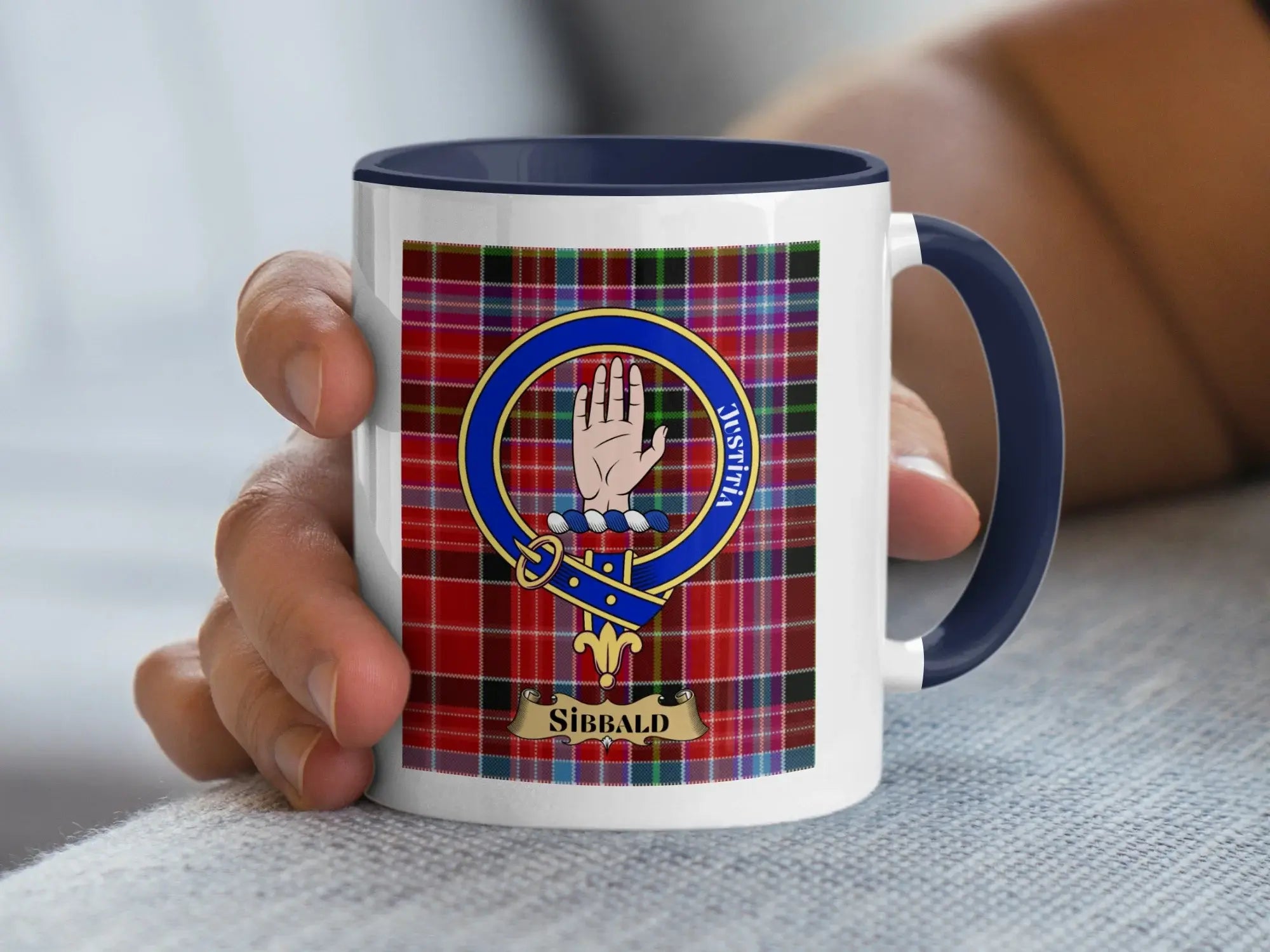 Sibbald family crest coffee mug with a tartan-background design