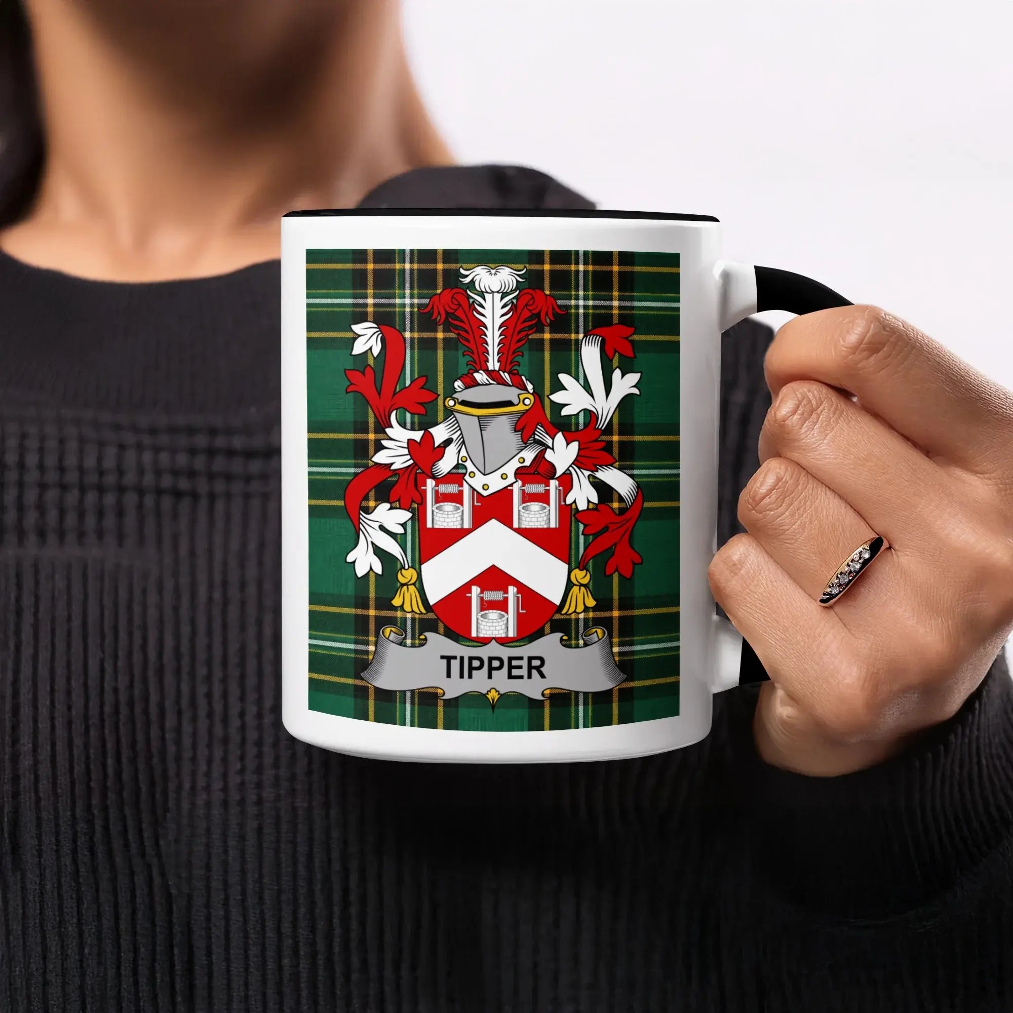White mug with Tipper family crest on tartan background.