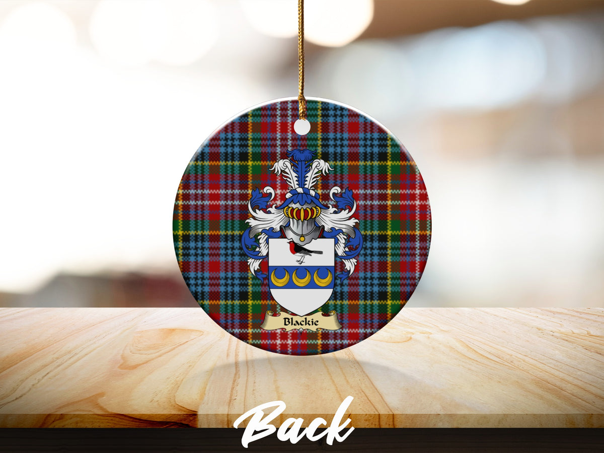Round Blackie Scottish clan ornament with family crest on a Caledonia tartan background