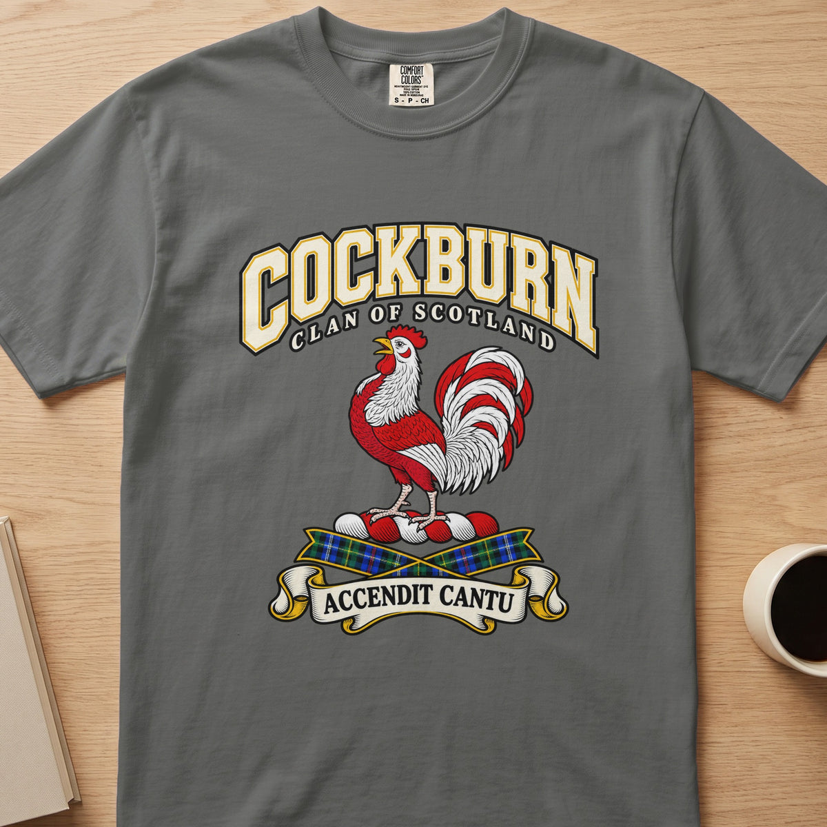 Cockburn red-and-white rooster crest graphic on a charcoal gray Comfort Colors T-shirt, front view