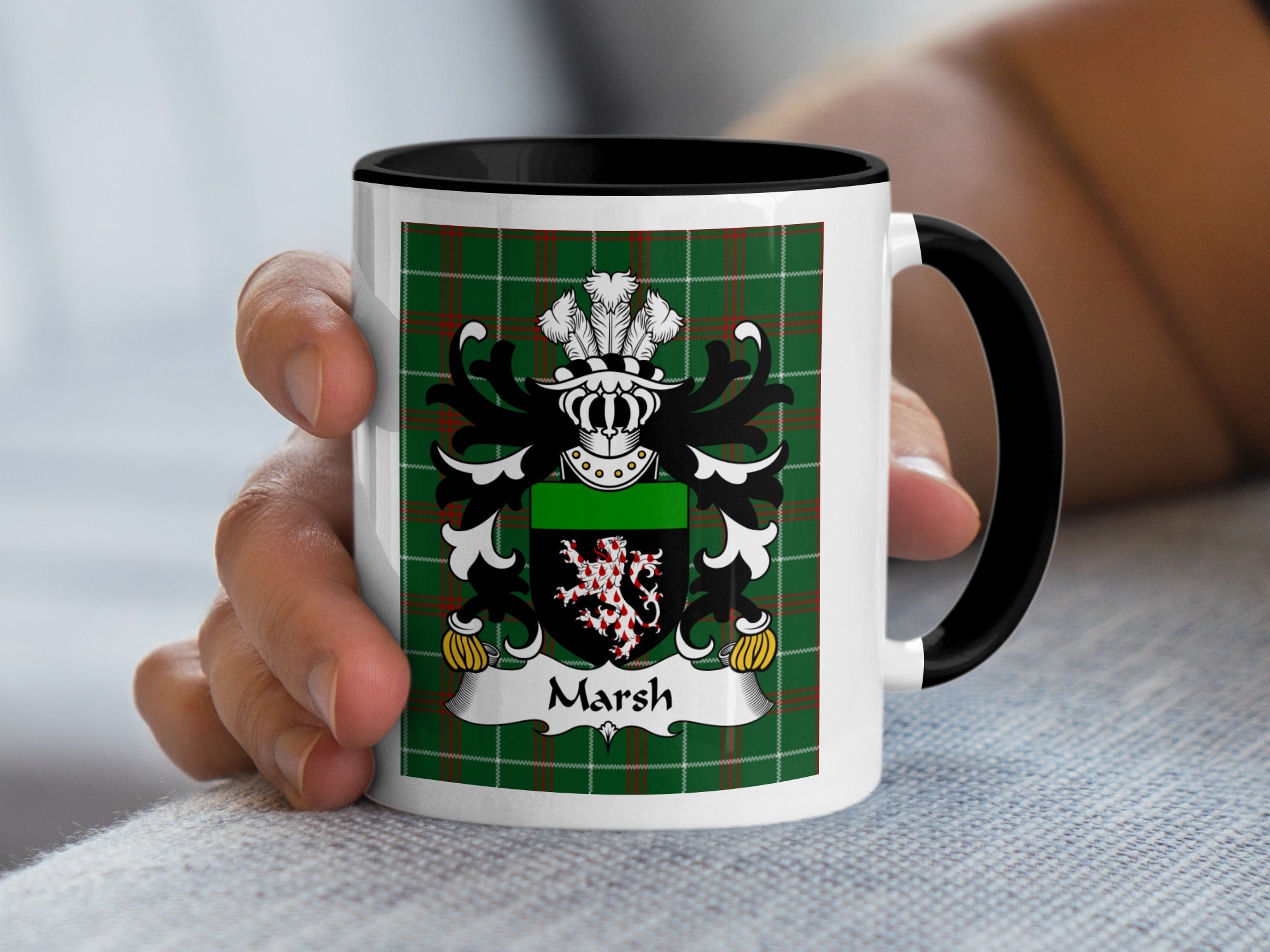 Mug with the Marsh family crest on a green plaid background.
