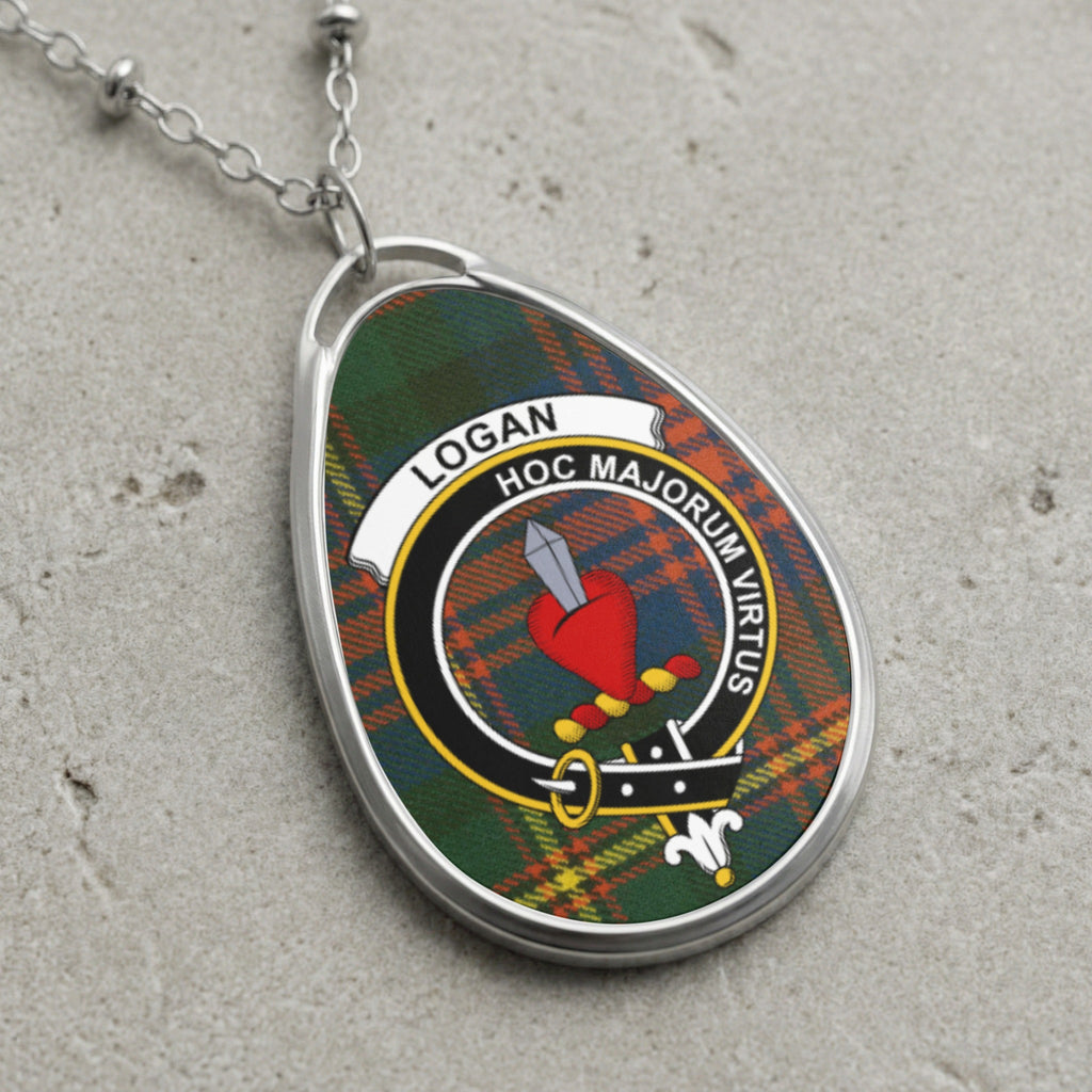 Logan clan Scottish tartan necklace with clan crest and Hoc Majorum Virtus motto on tartan background