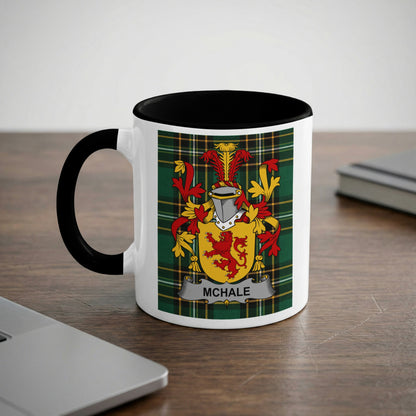White mug with black rim and handle displaying a family crest with "McHALE" text.