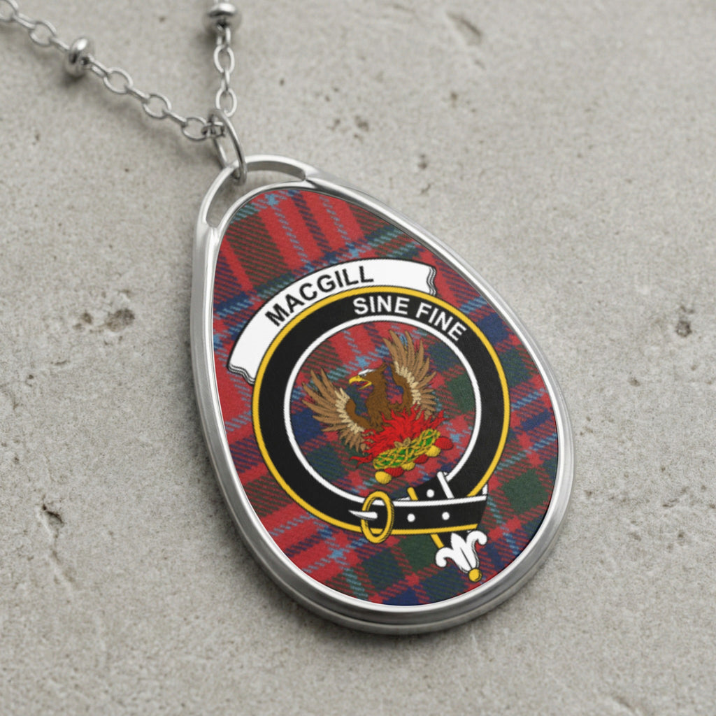 MacGill Sine Fine clan crest pendant on silver chain with tartan background.