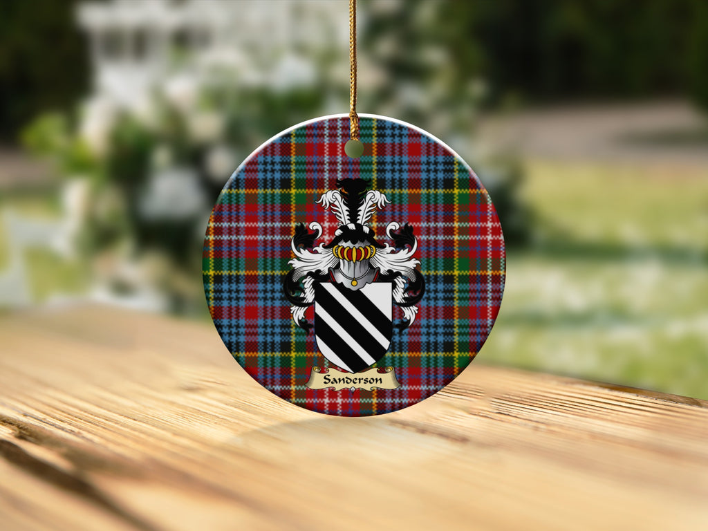 Round Sanderson Scottish clan ornament with family crest on a Caledonia tartan background