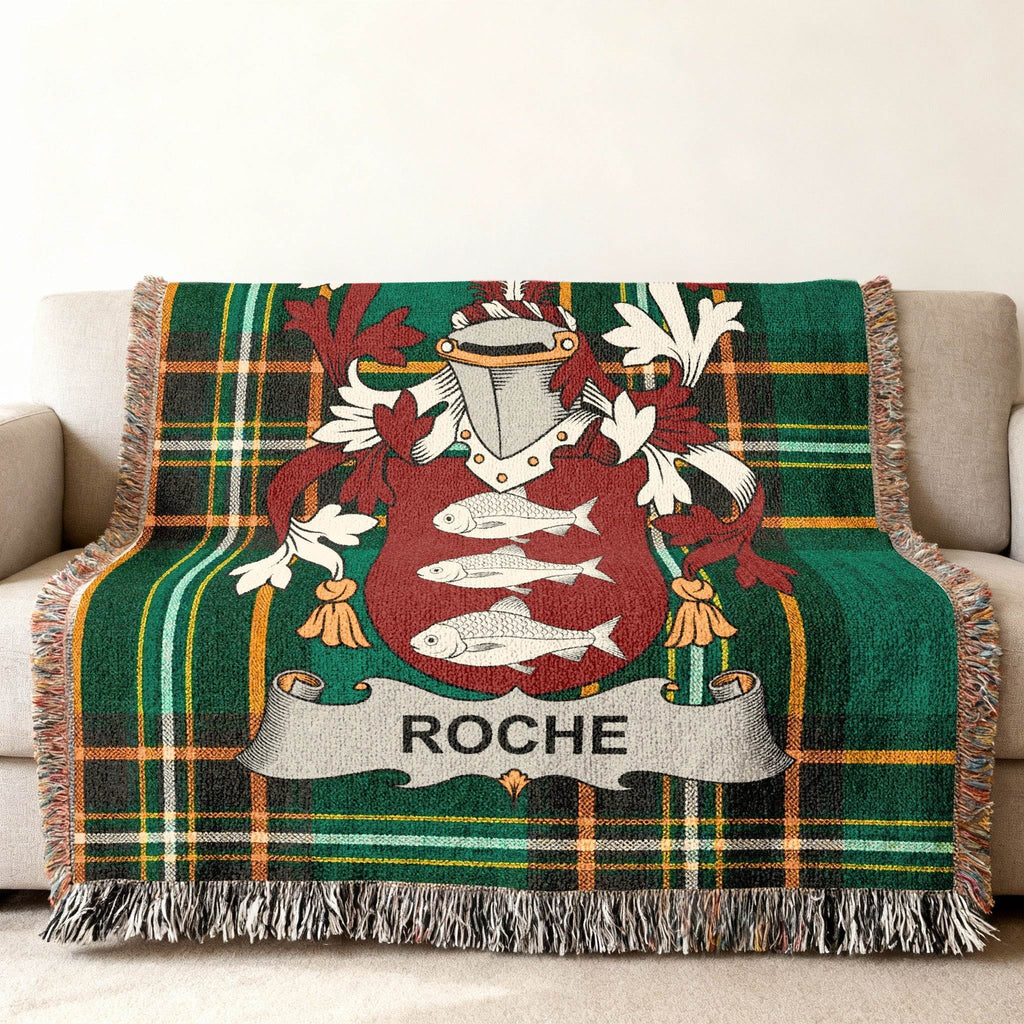 Green plaid throw blanket with Roche family crest featuring three fish.