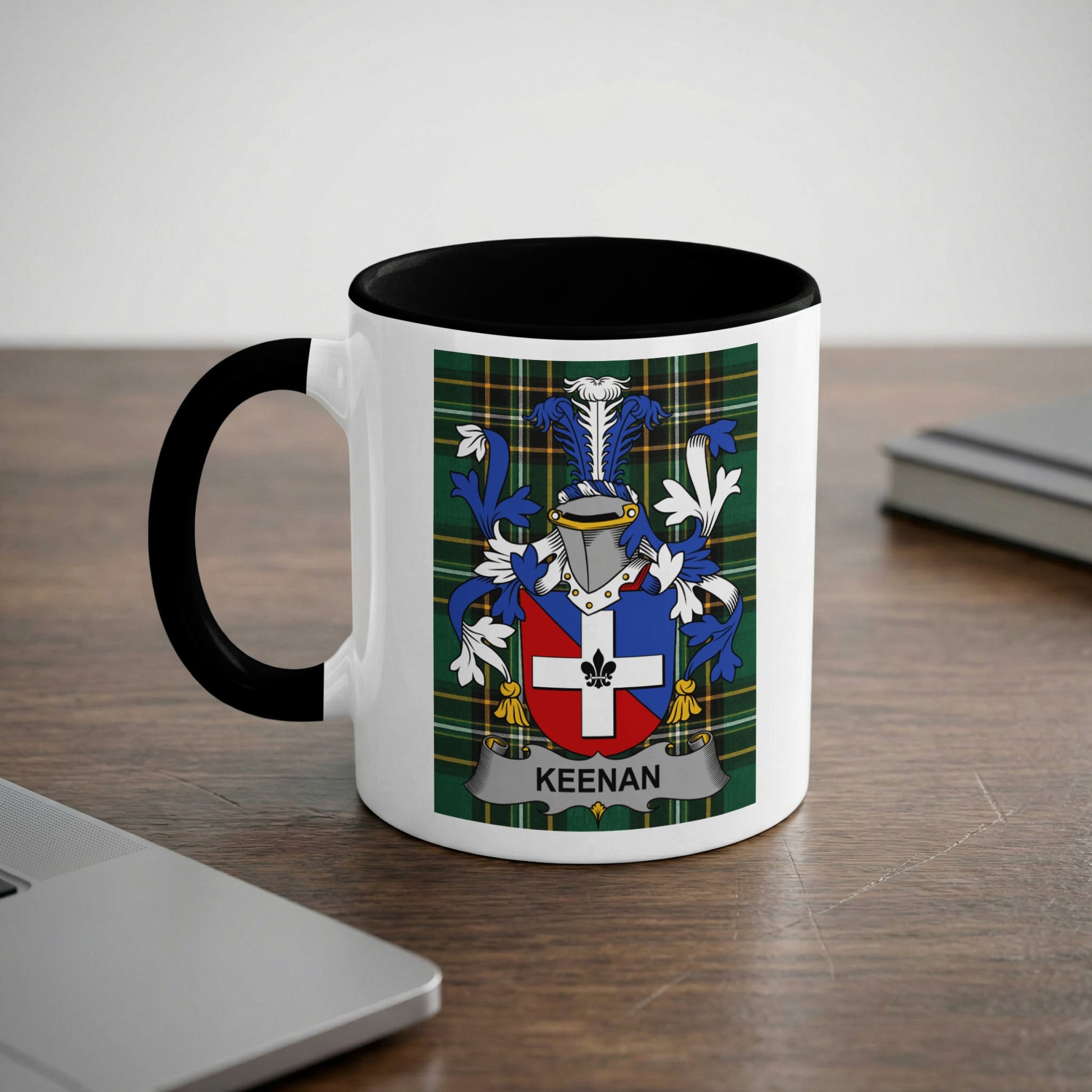 White mug with black rim featuring the KEENAN family crest on a plaid background.