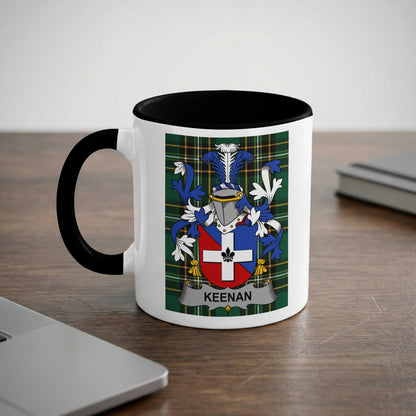 White mug with black rim featuring the KEENAN family crest on a plaid background.