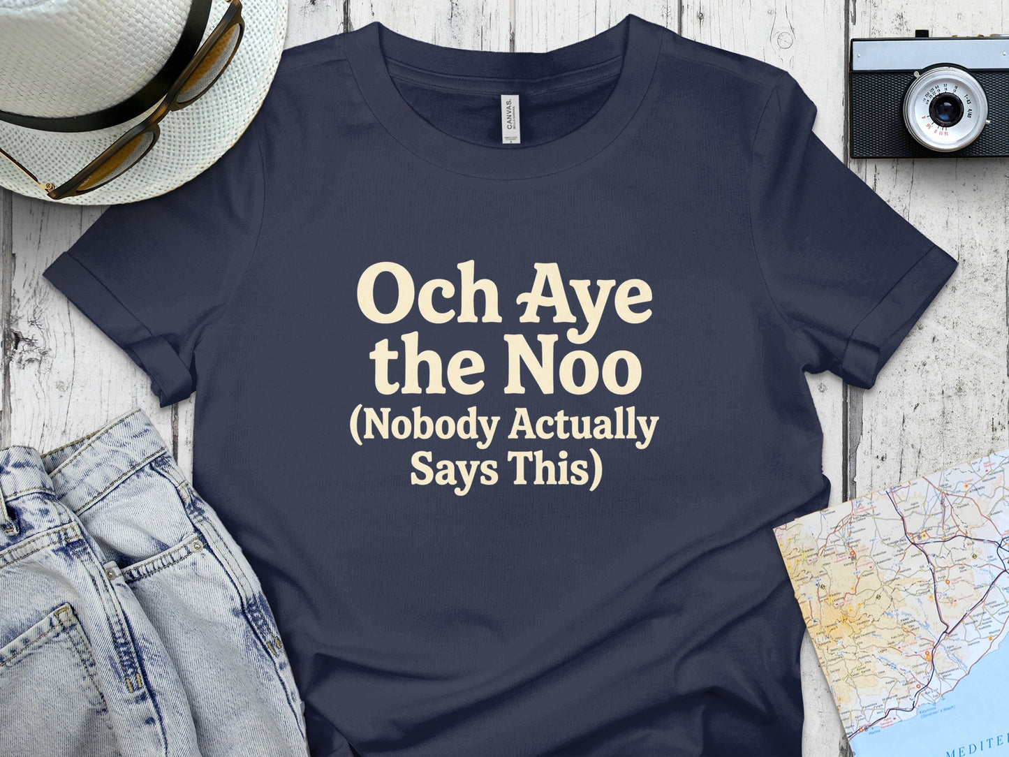 Navy t-shirt with "Och Aye the Noo (Nobody Actually Says This)" text.