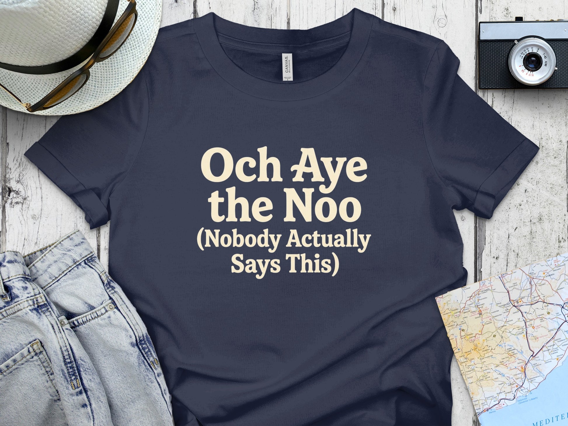 Navy t-shirt with "Och Aye the Noo (Nobody Actually Says This)" text.