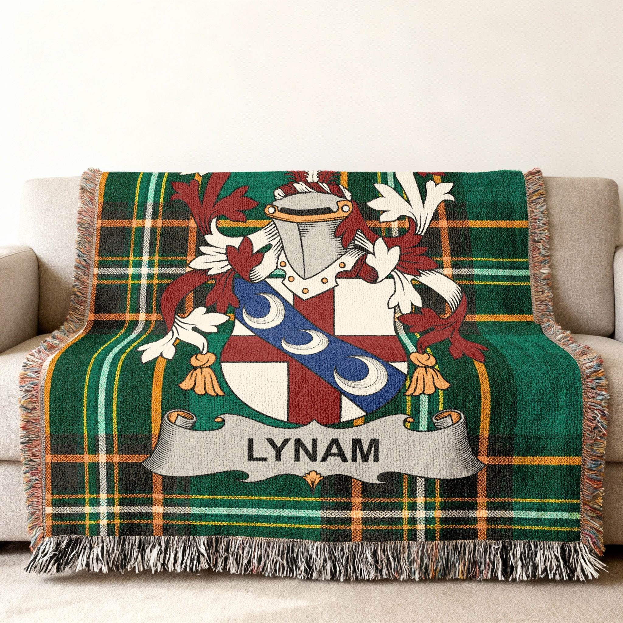 Green plaid blanket with Lynam family crest and name.