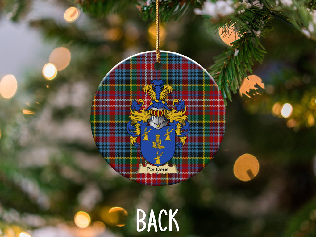 Porteous ceramic ornament detail showing a double-sided family shield on a Caledonia tartan background