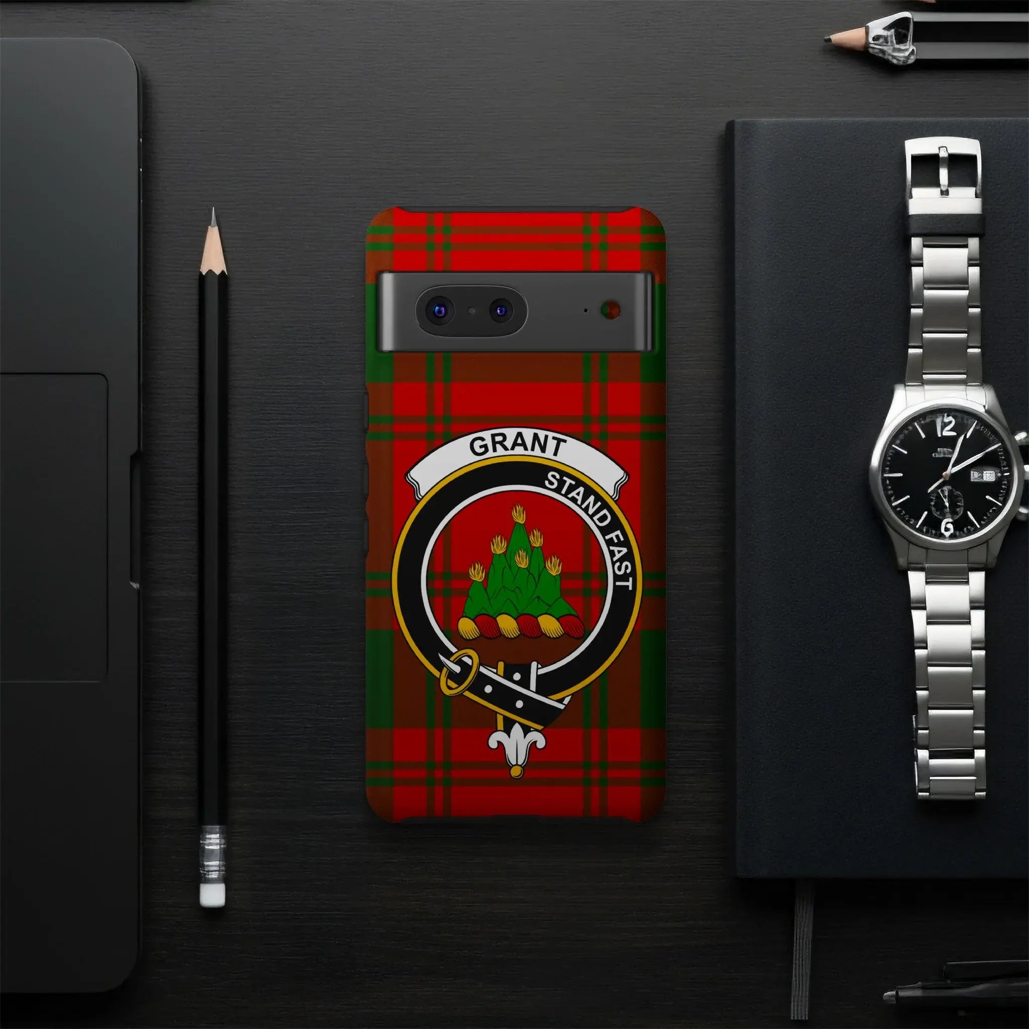 Grant Stand Fast clan crest phone case flat lay — full red-green tartan design visible