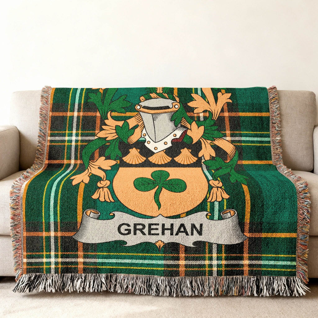Green tartan throw blanket with Grehan family crest.