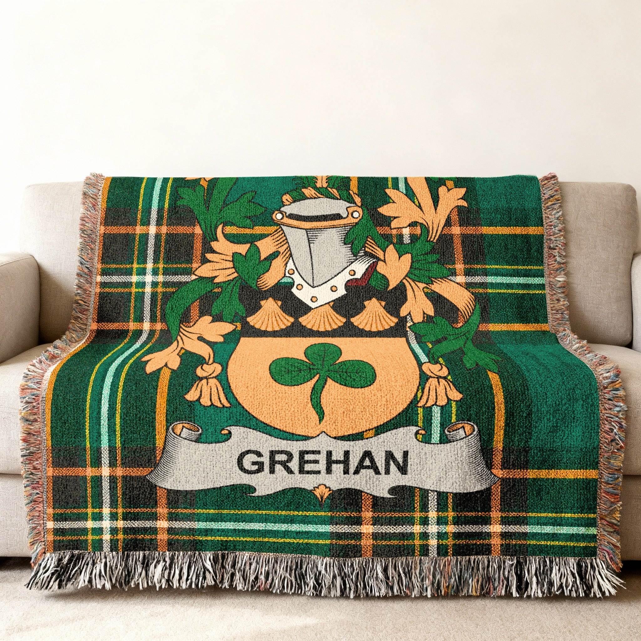 Green tartan throw blanket with Grehan family crest.