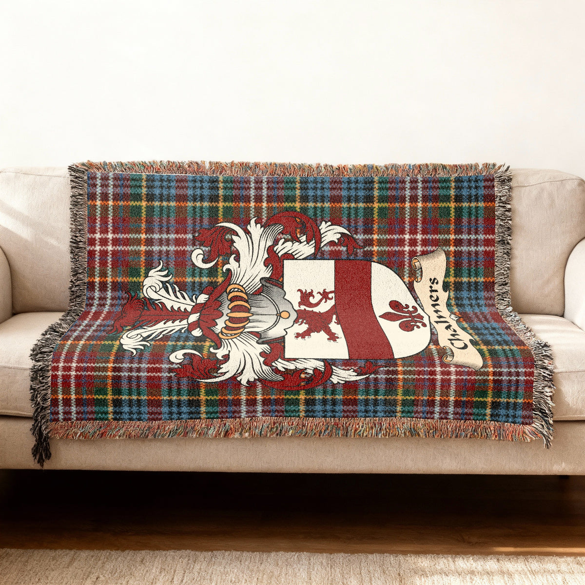 Chalmers Scottish woven blanket with family shield and Caledonia tartan background
