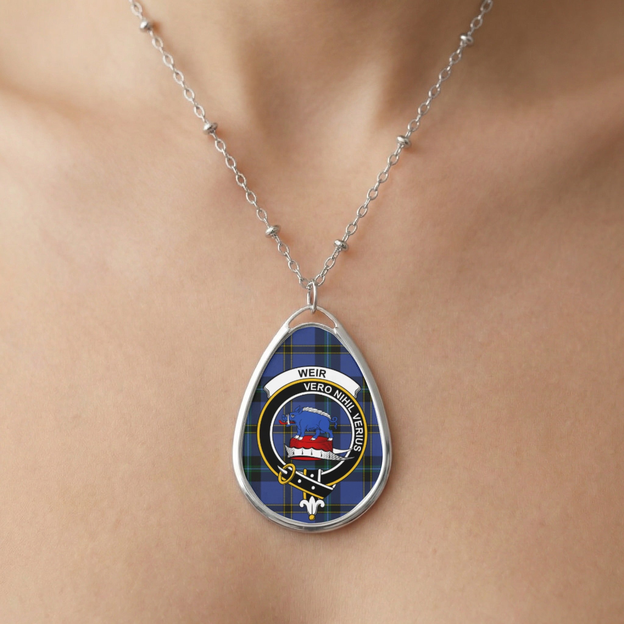 Silver necklace with oval pendant featuring Weir clan crest and tartan design