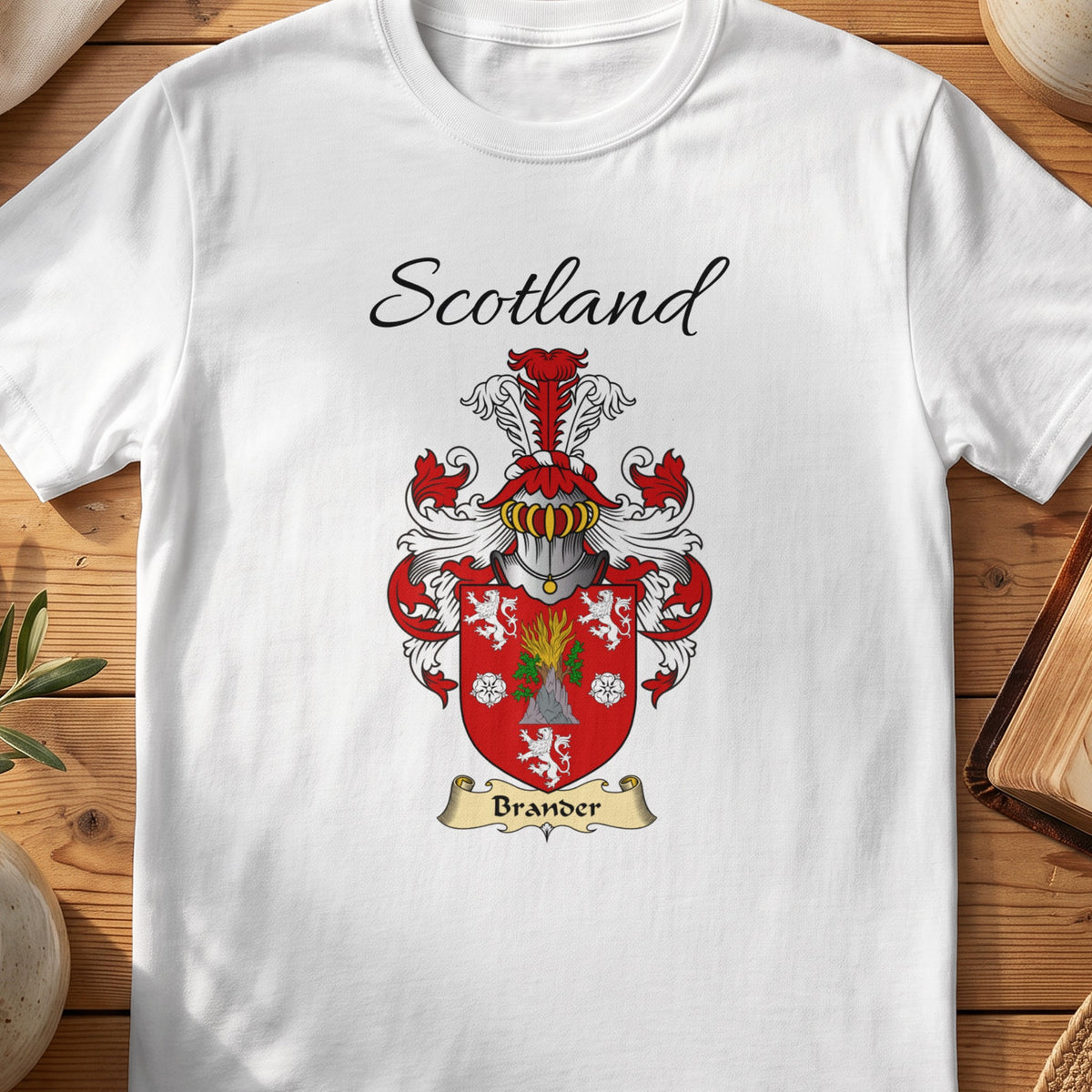 White Brander Scottish family shield T-shirt featuring a green foliage and white motifs on red