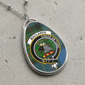 Maclaren clan crest on a tartan background oval pendant necklace with silver chain.
