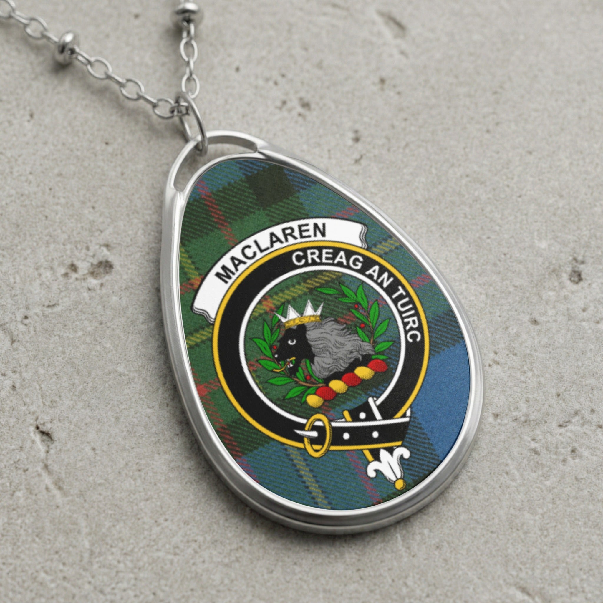 Maclaren clan crest on a tartan background oval pendant necklace with silver chain.