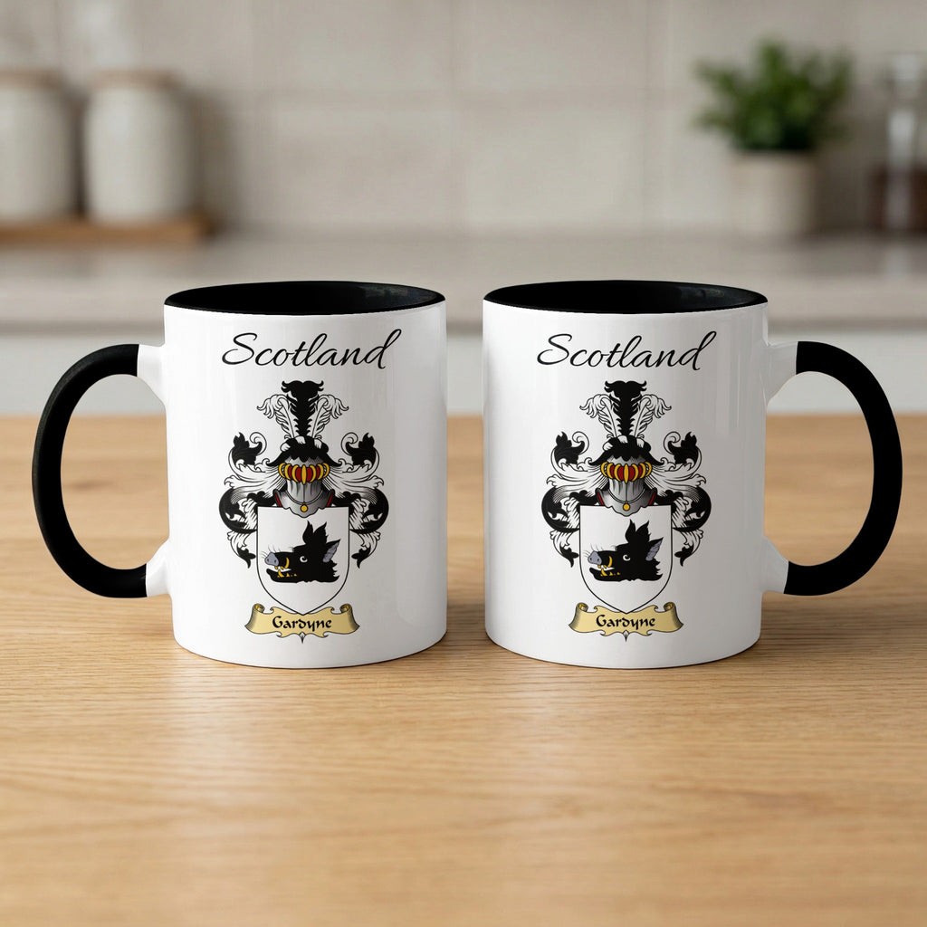 Two white Gardyne Scottish family shield mugs with black handles, artwork shown on both sides