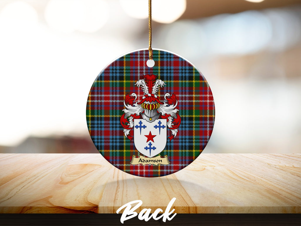 Round Adamson Scottish clan ornament with family crest on a Caledonia tartan background