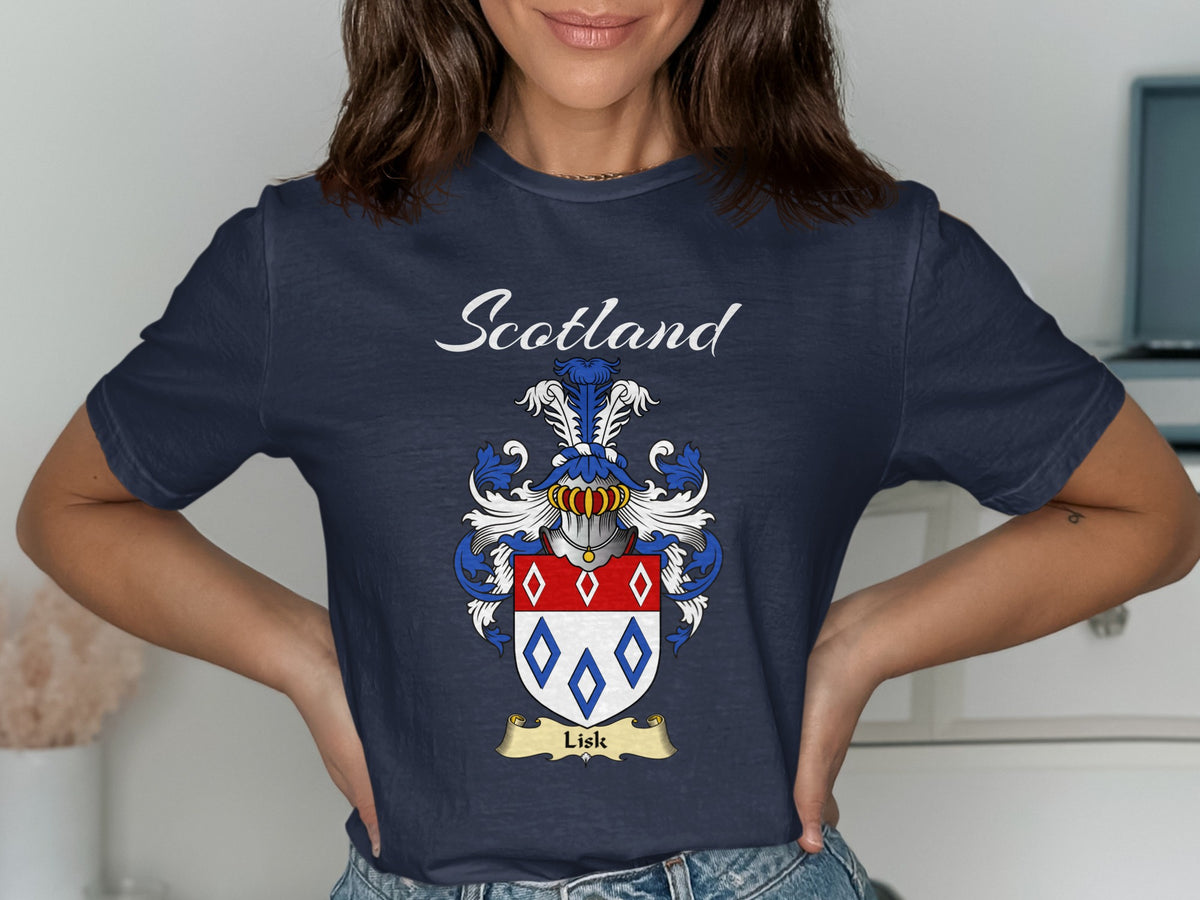 Model wearing a navy Lisk T-shirt featuring red-and-blue diamond outlines on a pale shield