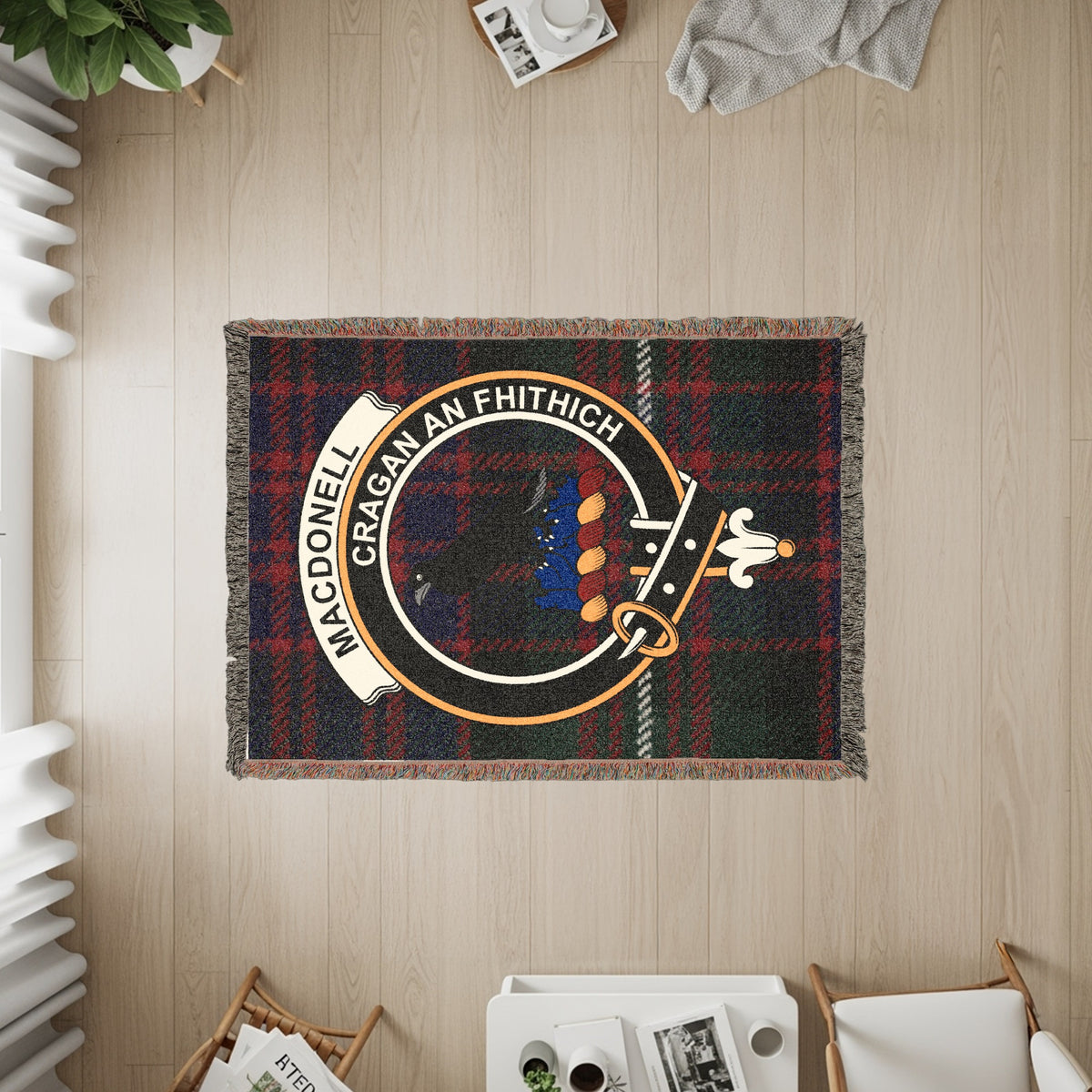 MacDonell of Glengarry woven blanket displayed on a wall, featuring the crest badge and tartan background