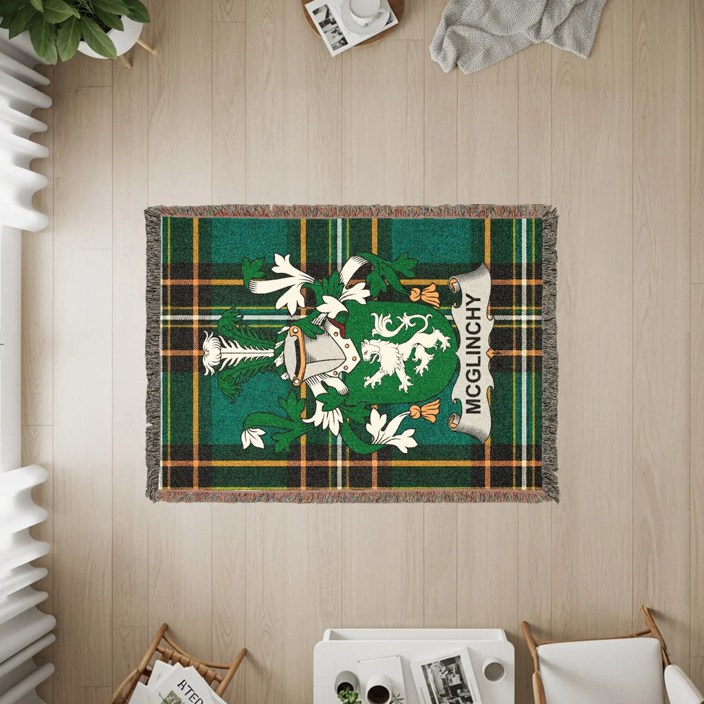Green plaid blanket featuring the McGlinchy family crest in the center.
