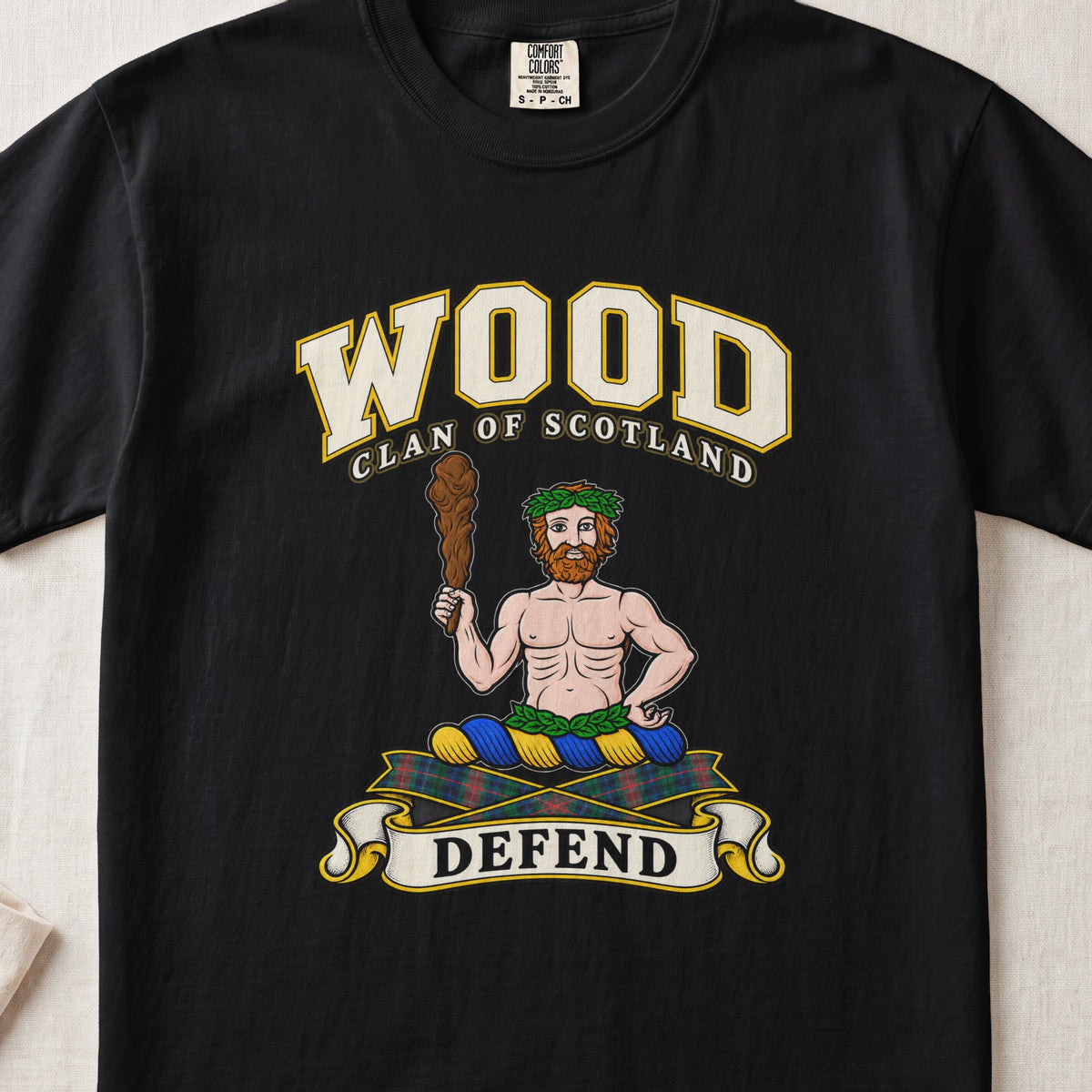 Wood Scottish clan T-shirt in Black, front view with a bearded figure holding a wooden club and motto banner.
