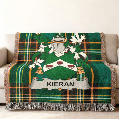 Kieran family crest on green plaid woven throw blanket on sofa.