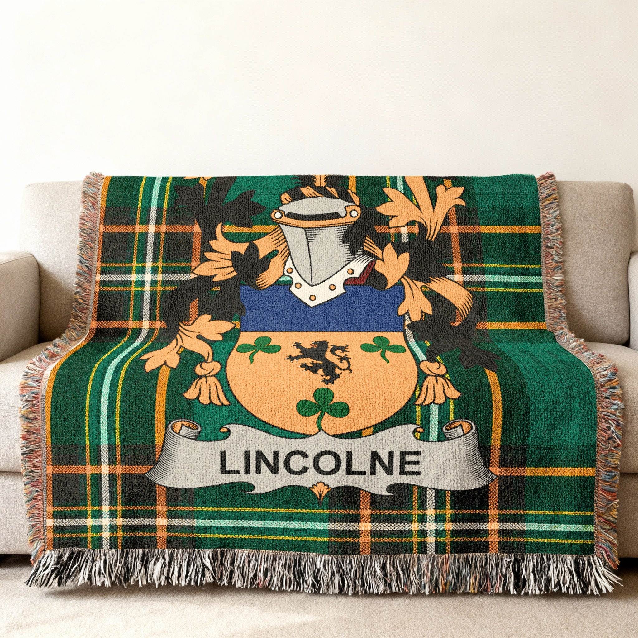 Green plaid throw blanket with Lincoln family crest.