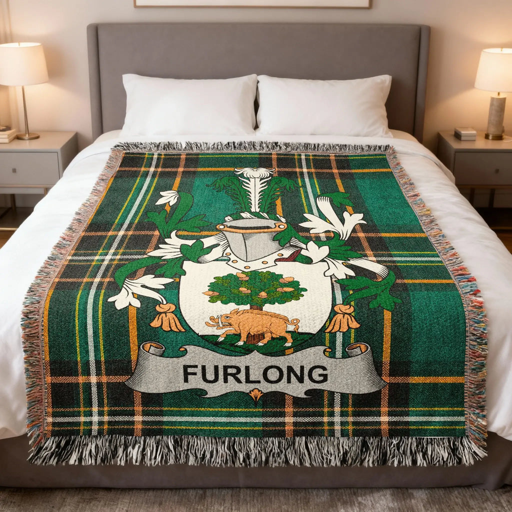 Furlong crest on a green plaid blanket with fringe.