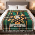 Purcell clan crest on a green plaid wool blanket on a bed.