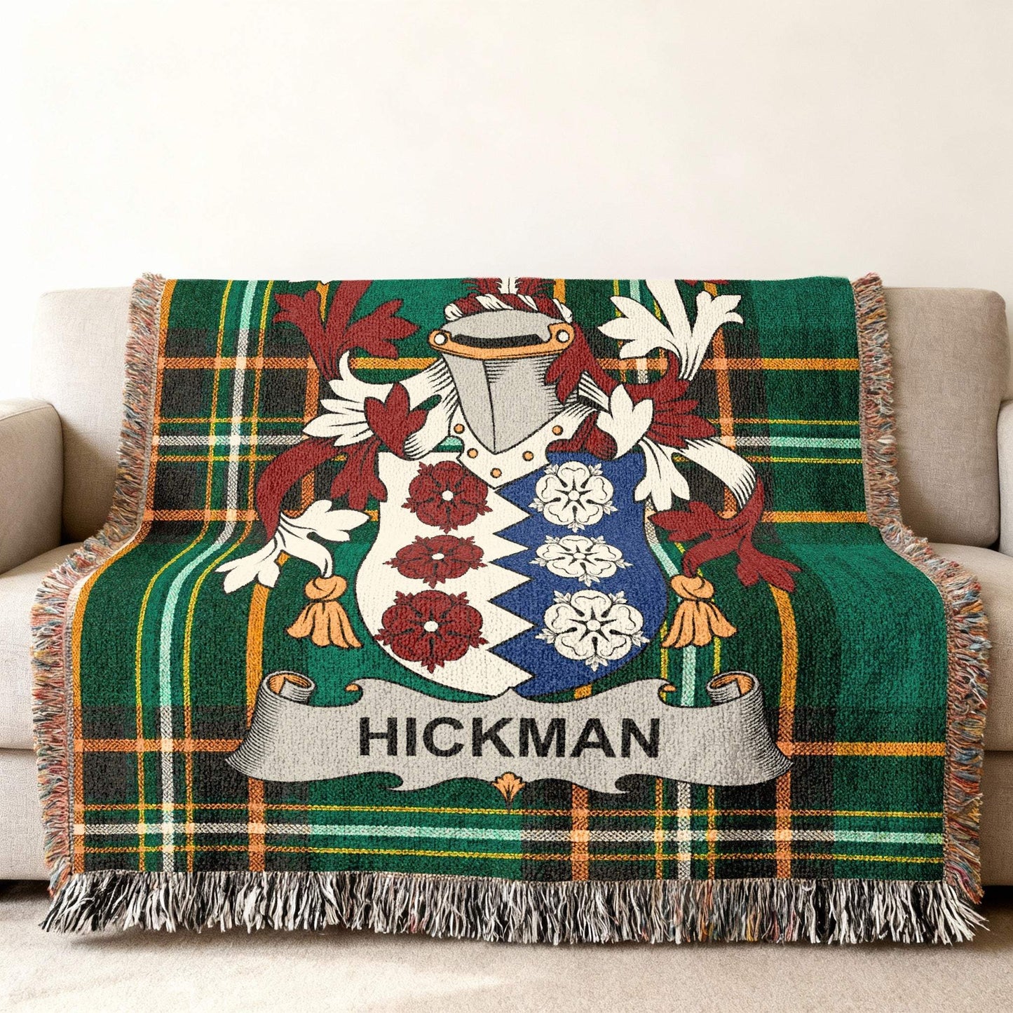 Hickman family crest on a green and red plaid woven blanket.