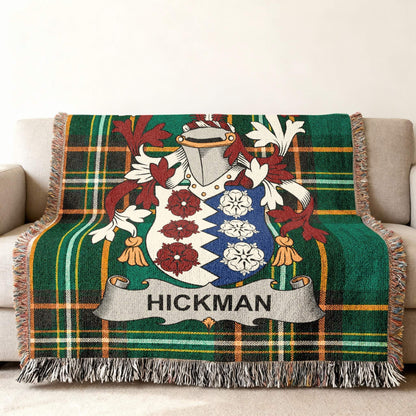 Hickman family crest on a green and red plaid woven blanket.