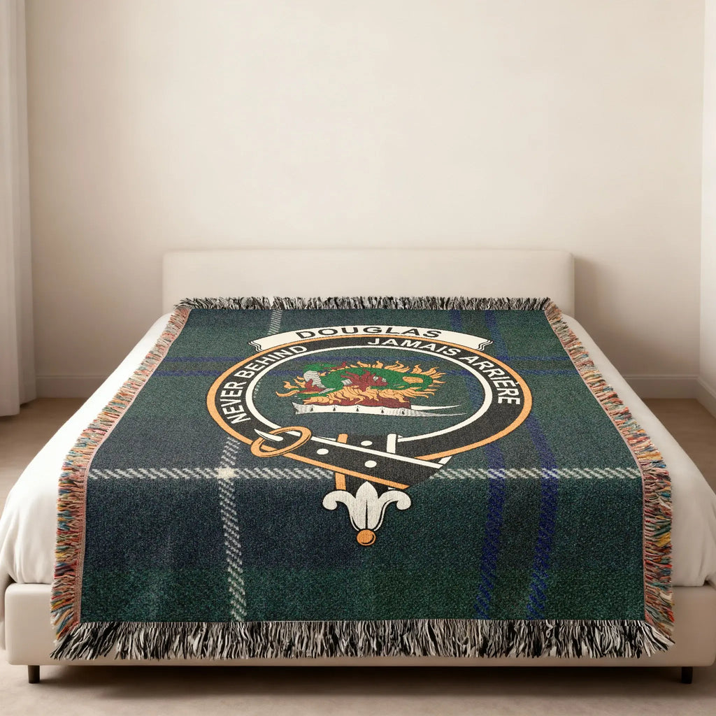 Douglas clan crest tartan woven blanket — Never Behind emblem at centre, fringe edge visible