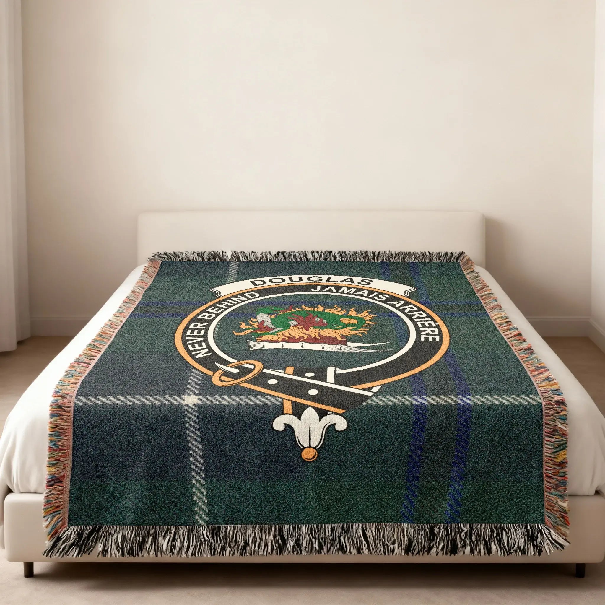 Douglas clan crest tartan woven blanket — Never Behind emblem at centre, fringe edge visible