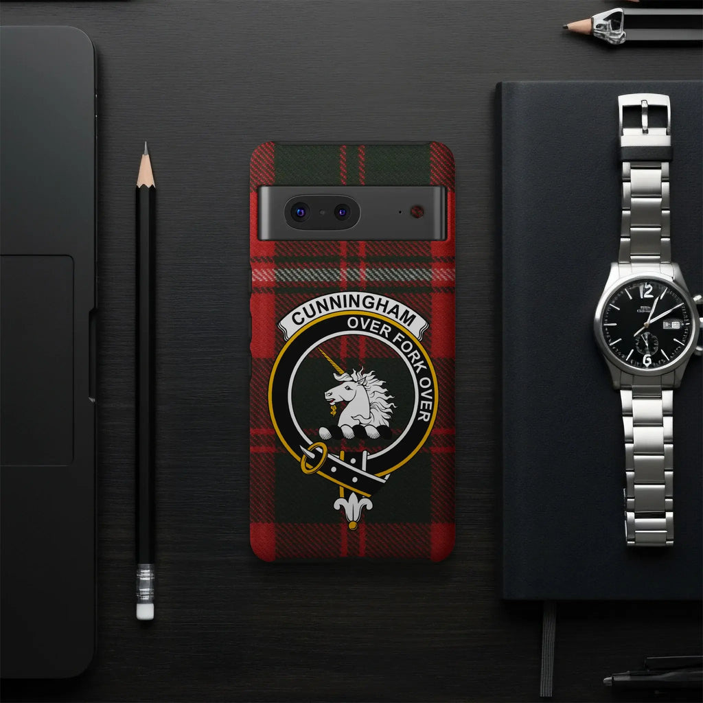 Cunningham Over Fork Over tartan phone case flat lay — full unicorn crest and plaid design visible