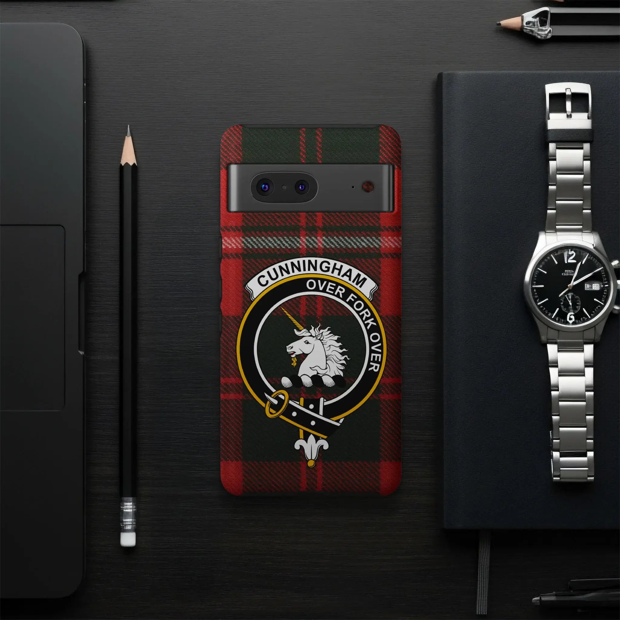 Cunningham Over Fork Over tartan phone case flat lay — full unicorn crest and plaid design visible