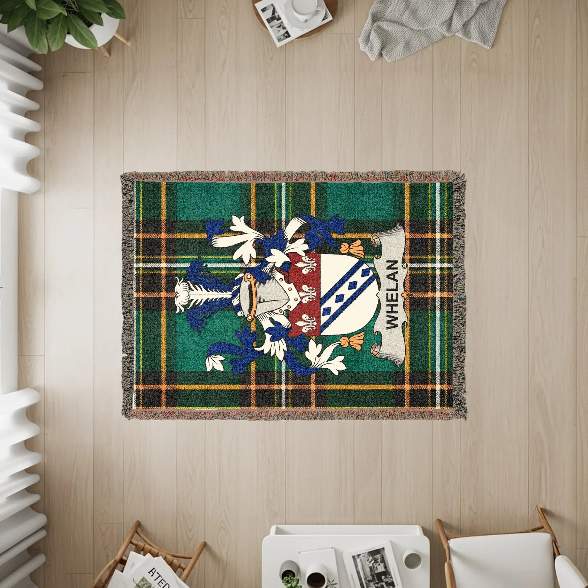 Whelan family crest on a plaid woven blanket with tassels.