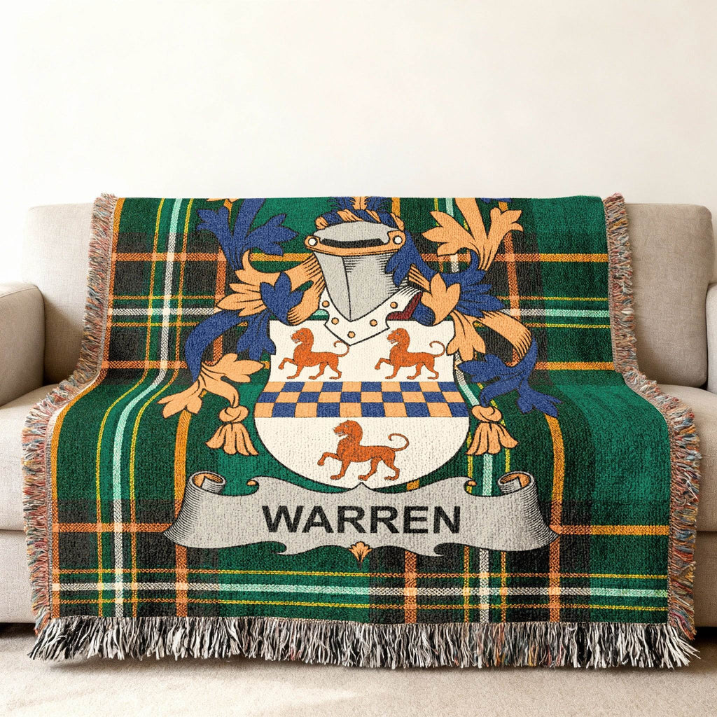 Green tartan blanket with a Warren family crest featuring lions.