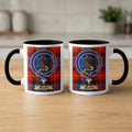 Watt family crest mugs front and back — black accents on tartan background