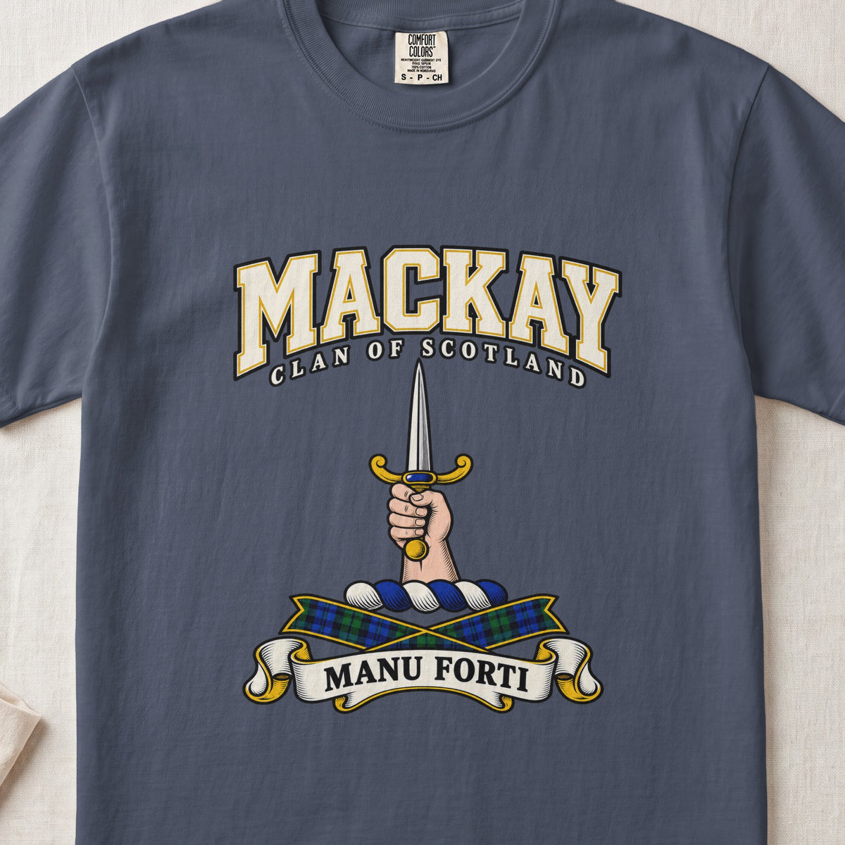 MacKay graphic T-shirt in Midnight blue, front flat lay showing varsity lettering and hand and forearm holding an upright silver dagger with gold hilt.