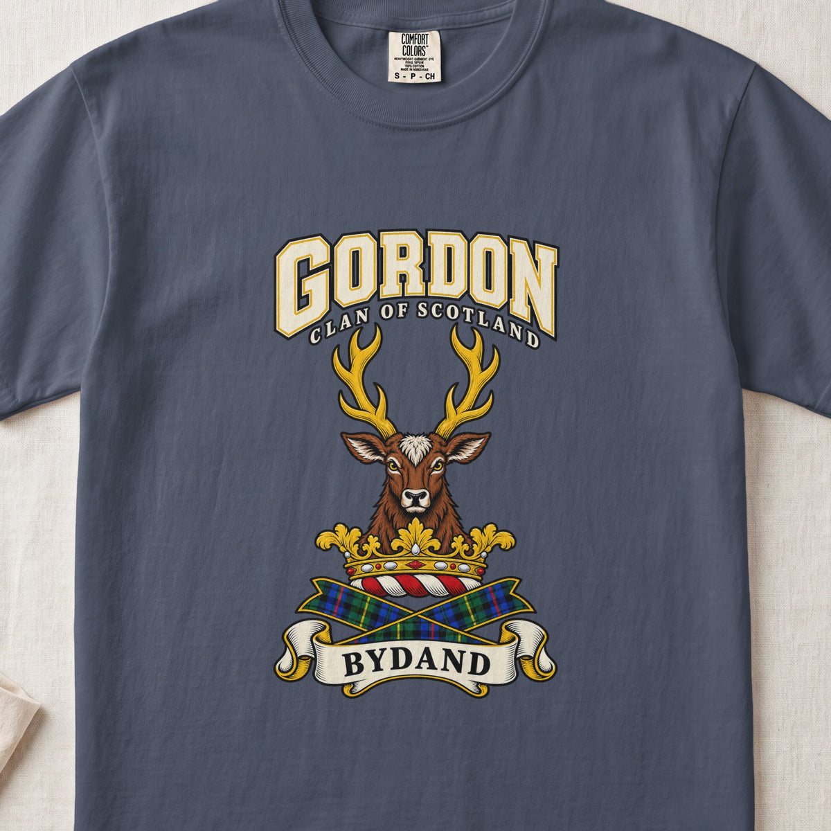 Gordon graphic T-shirt in Midnight blue, front flat lay showing varsity lettering and forward-facing brown stag head with gold antlers.