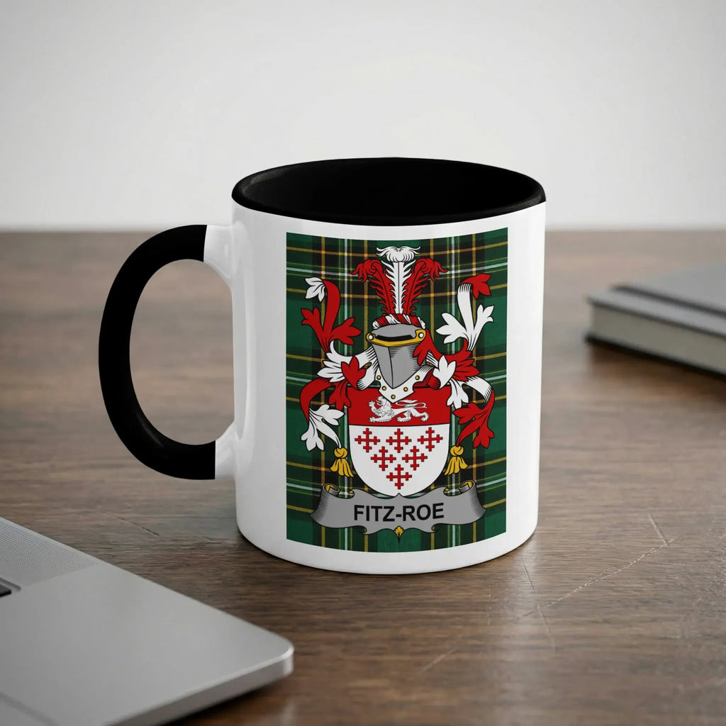 White mug with black rim featuring Fitz-Roe family crest on a plaid background.