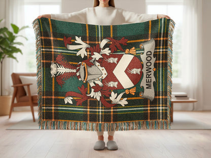 Merwood family crest on a green plaid tartan blanket.