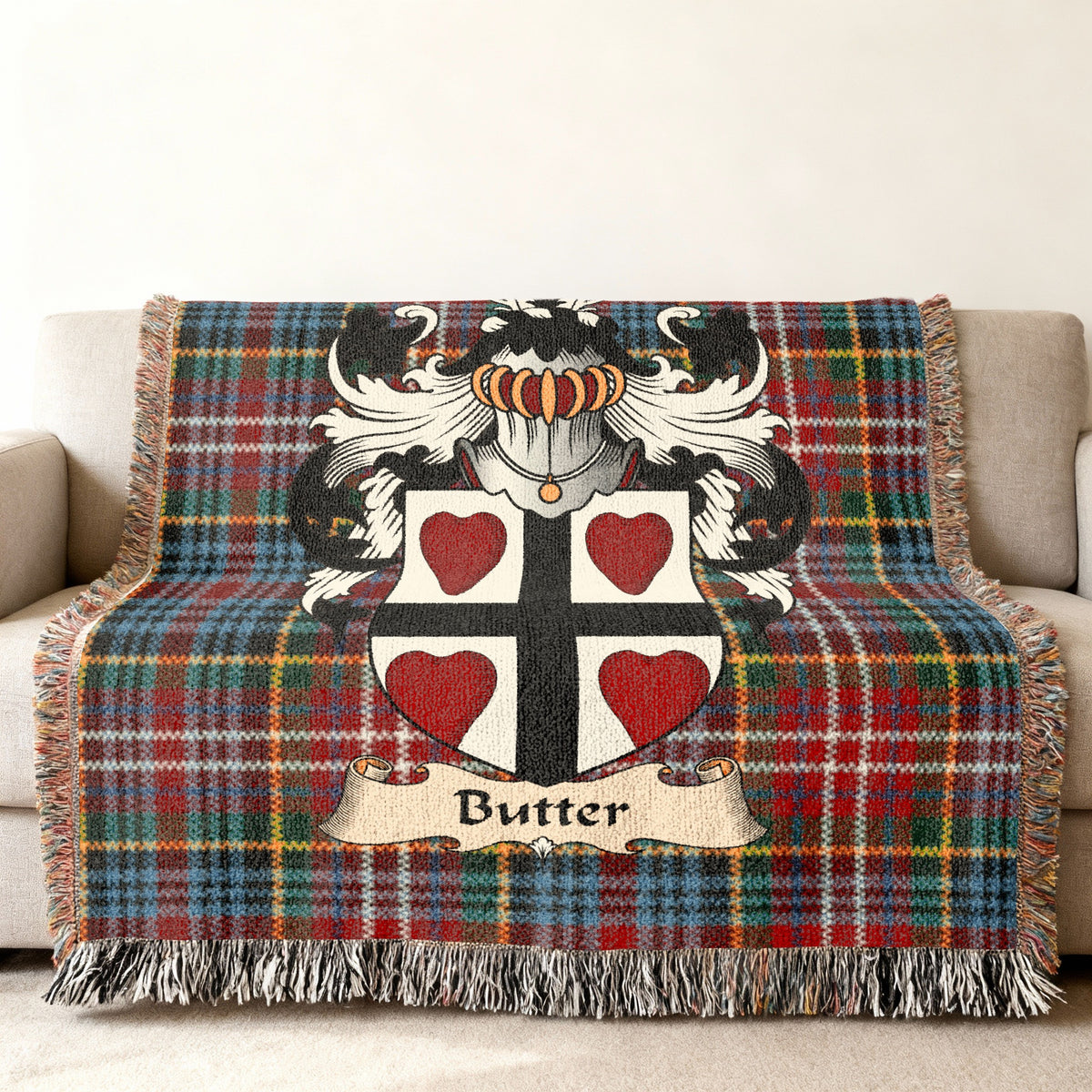 Butter Scottish family shield woven blanket on a Caledonia tartan background