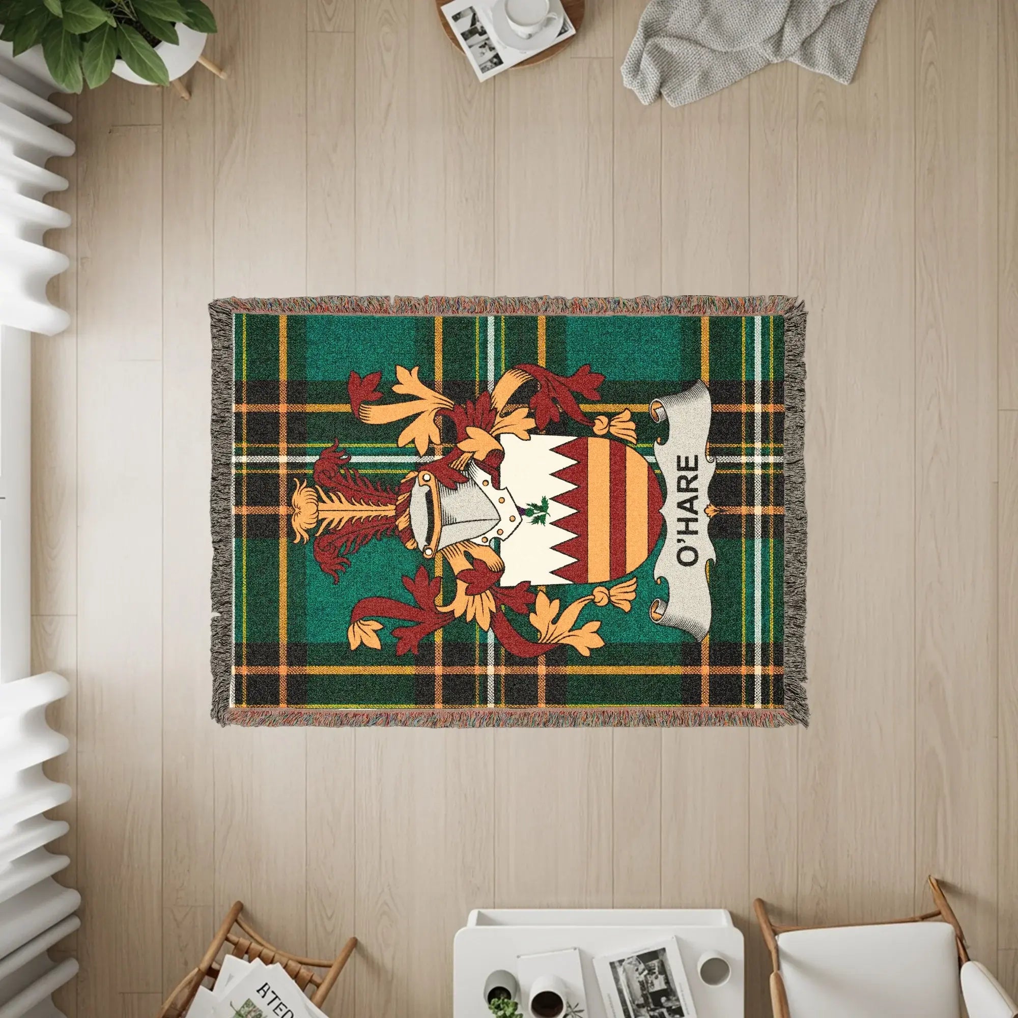 O'Hare family crest on a green plaid woven throw blanket with fringe.