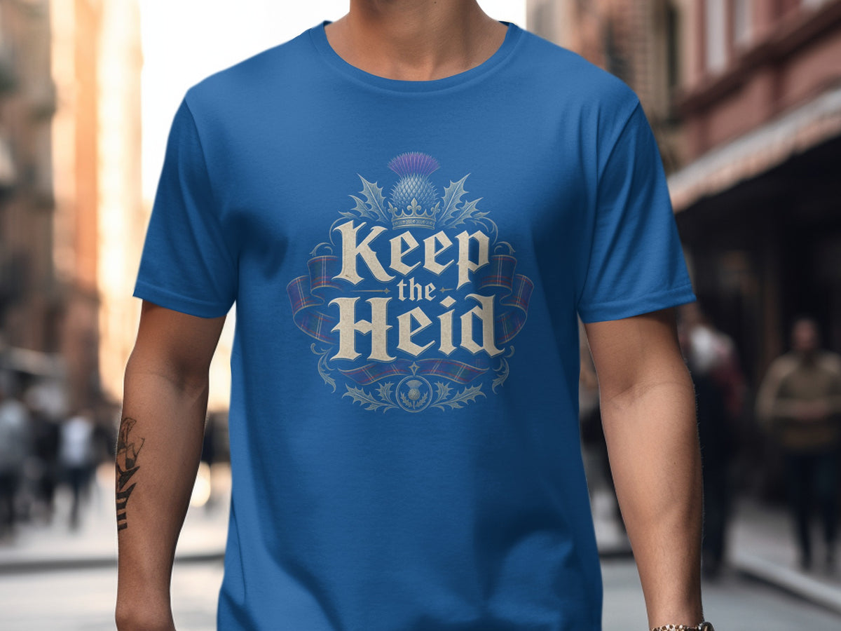 Blue t-shirt with "Keep the Heid" text, thistle, crown, and tartan ribbon design.